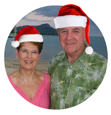 Ron and Sherry on beach in kringle hats