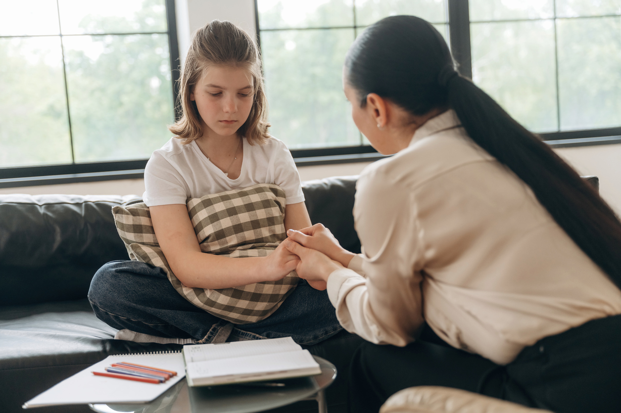 A counselor offering support to a client during an in-person session