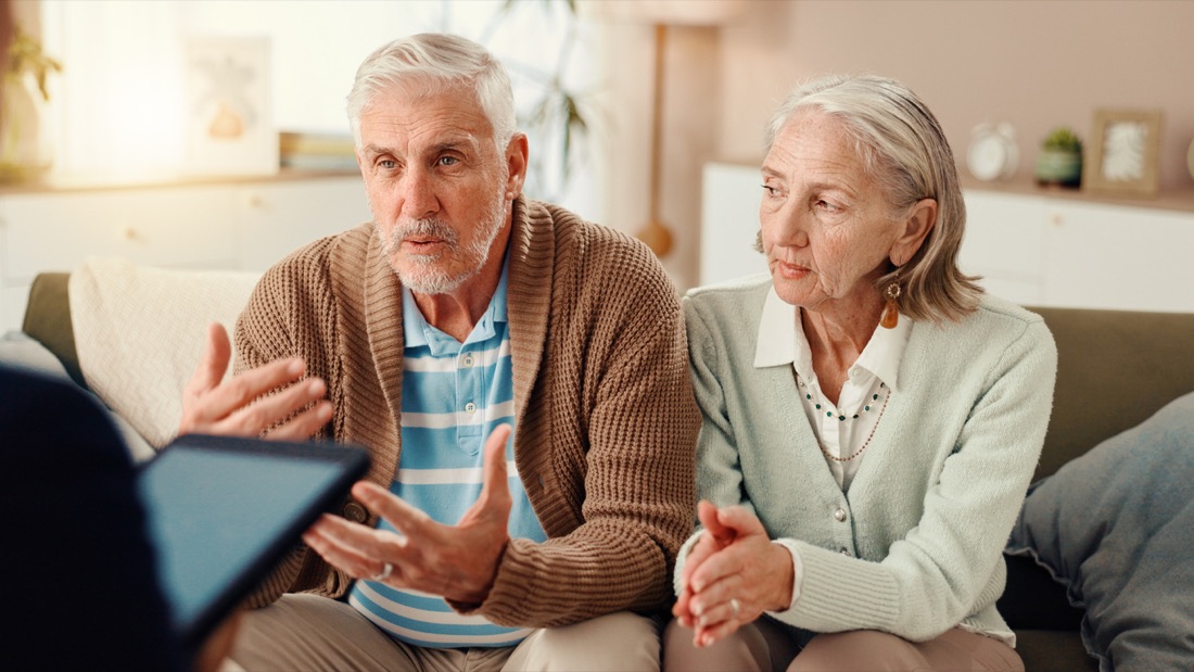 An older couple talking together with their biblical counselor
