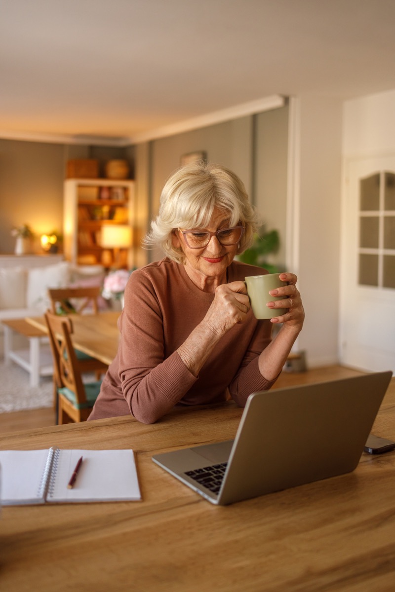 A woman meeting with a counselor online from home